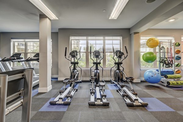 fitness center at The Orchards at Arlington Highlands Apartments