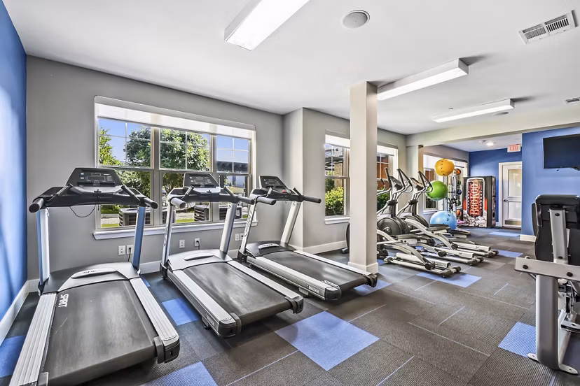 Modern fitness center with state-of-the-art equipment at The Orchards at Arlington Highlands Apartments