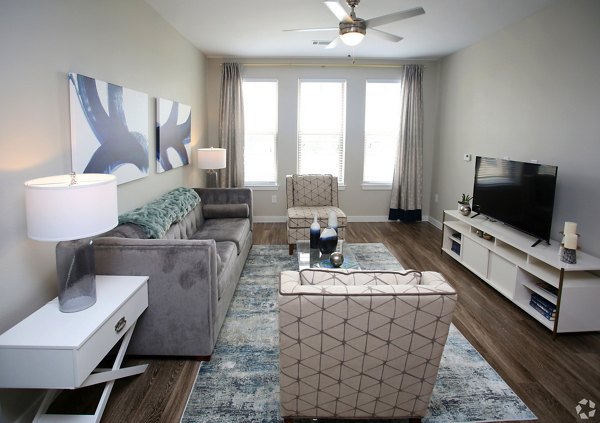 Spacious living room with modern decor at The Orchards at Arlington Highlands Apartments