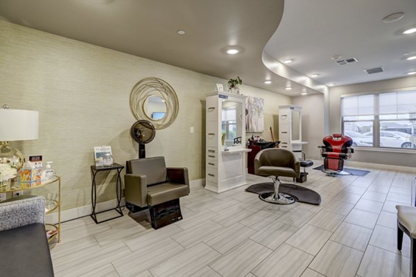 Hair salon with modern styling stations at The Orchards at Arlington Highlands Apartments, featuring luxury services and amenities for residents