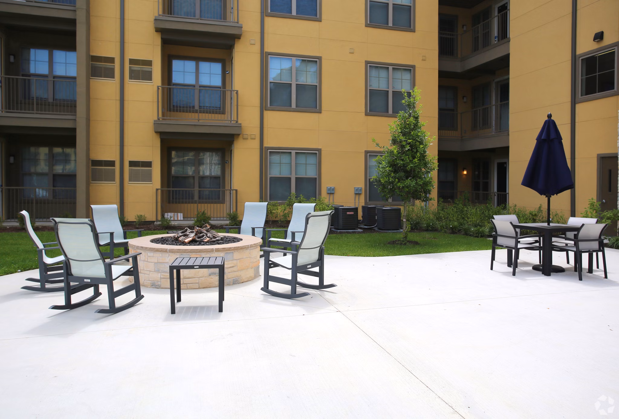 Cozy outdoor fire pit area at The Orchards at Arlington Highlands Apartments