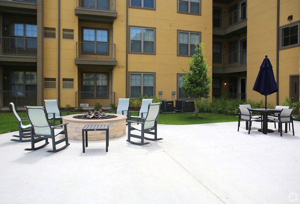 Cozy outdoor fire pit area at The Orchards at Arlington Highlands Apartments
