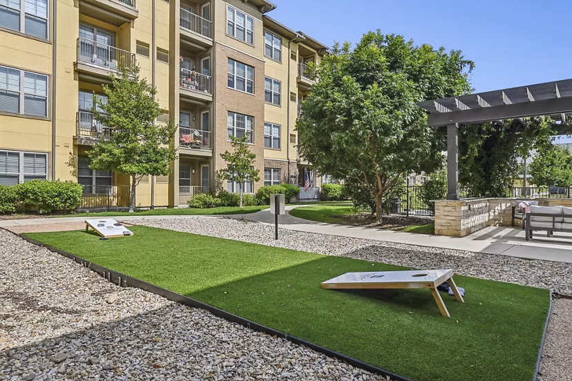 Grill area with modern seating at The Orchards at Arlington Highlands Apartments