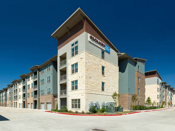The Orchards at Market Plaza: Elegant view of luxury apartments in a vibrant neighborhood