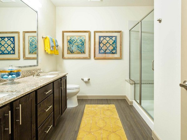 Modern bathroom with sleek fixtures at The Orchards at Market Plaza Apartments