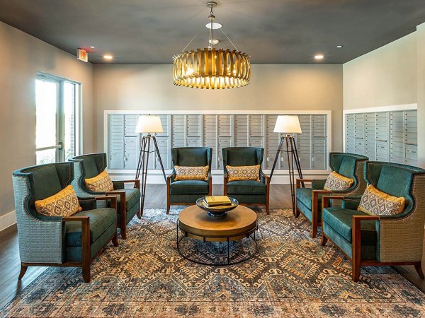 Clubhouse featuring modern decor and amenities at The Orchards at Market Plaza Apartments