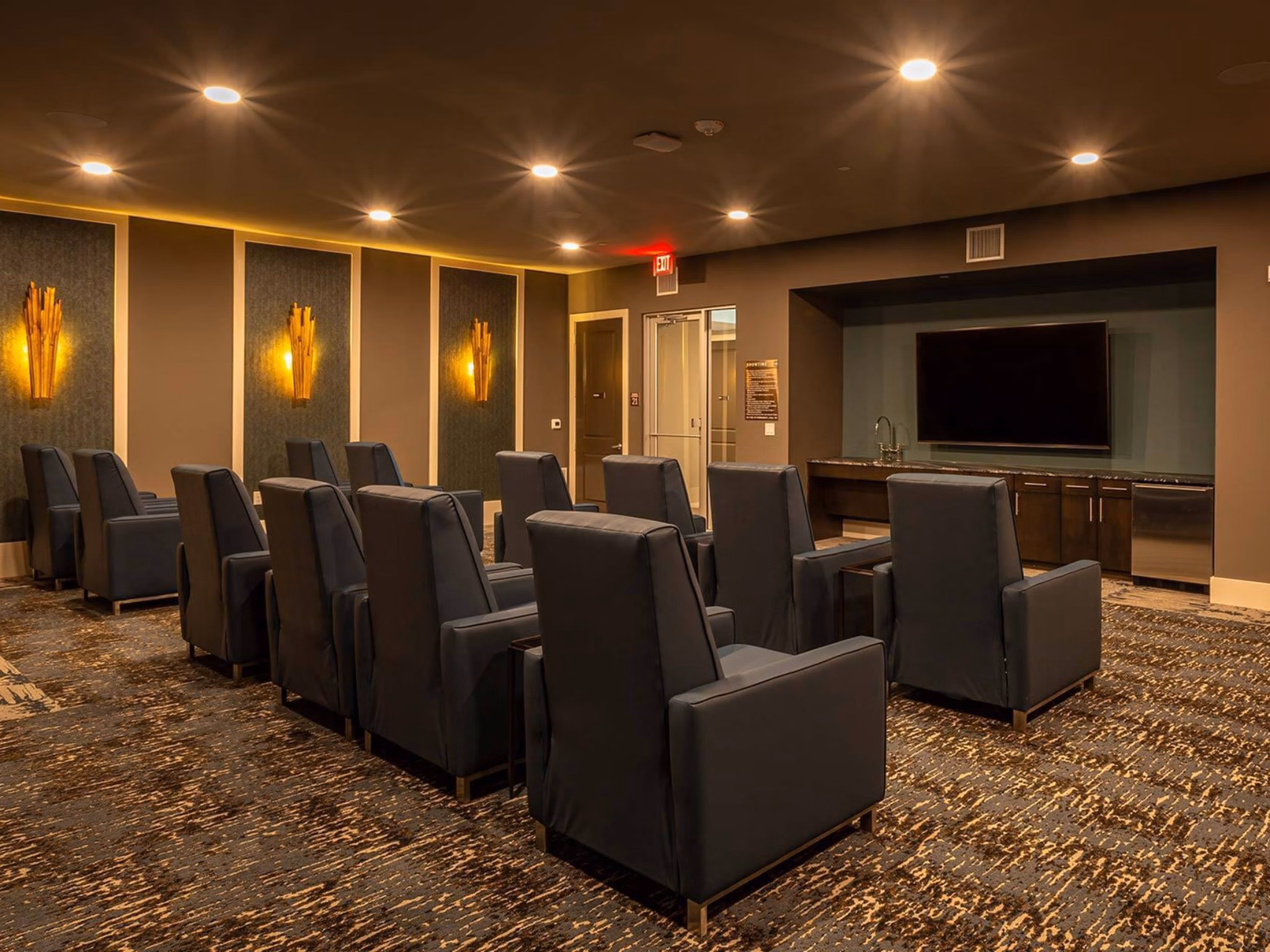 Theater with plush seating at The Orchards at Market Plaza Apartments