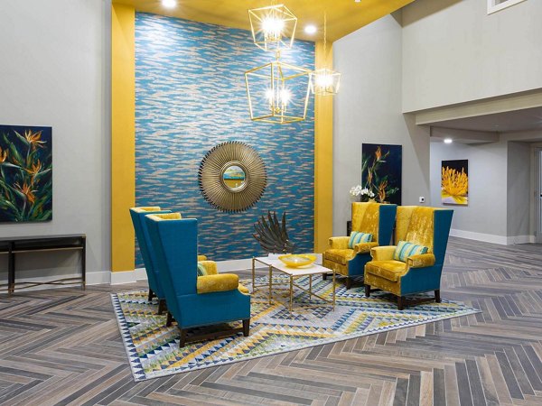 Clubhouse featuring modern decor and lounge seating at The Orchards at Market Plaza Apartments