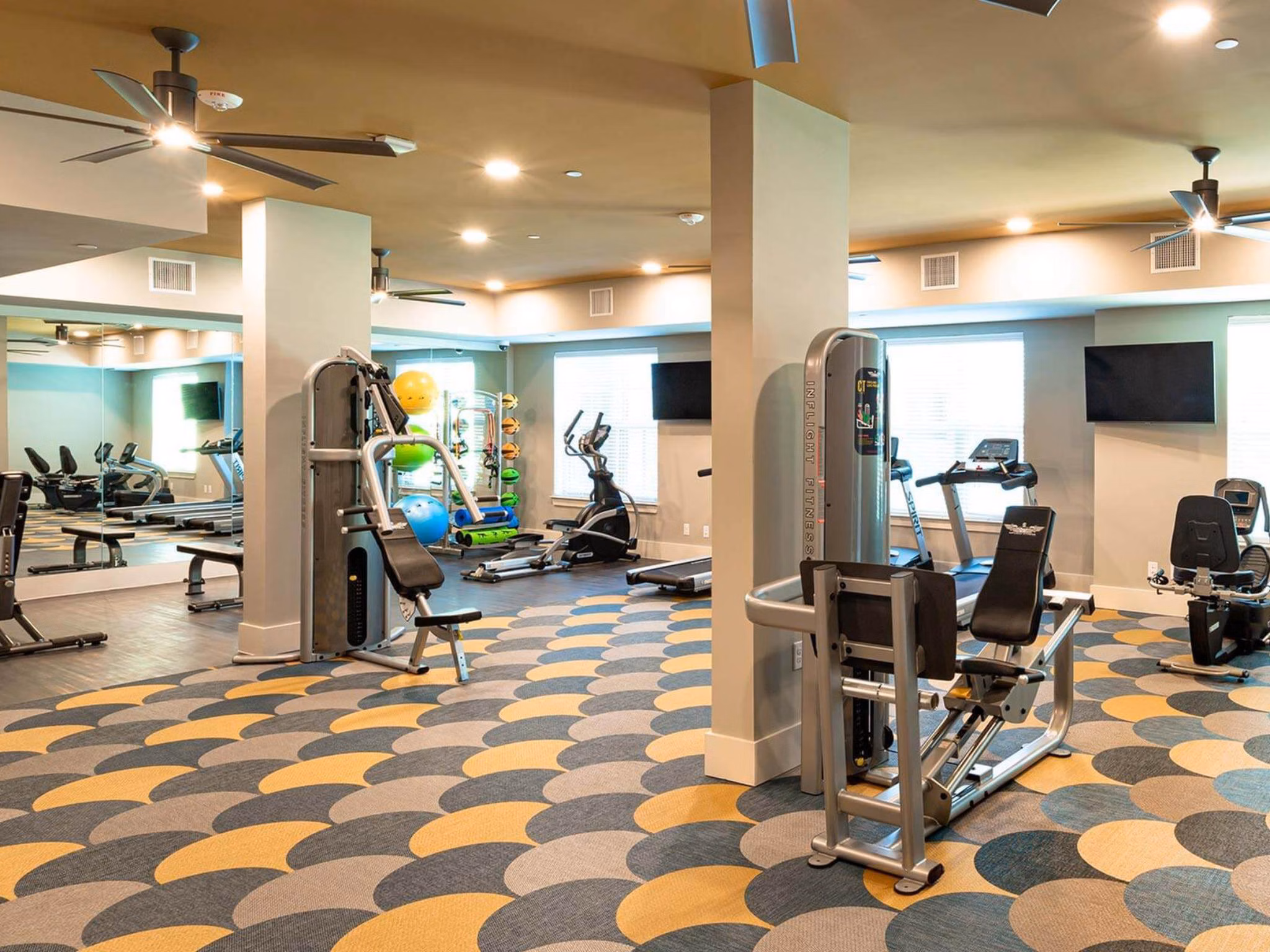 Fully-equipped fitness center with modern equipment at The Orchards at Market Plaza Apartments