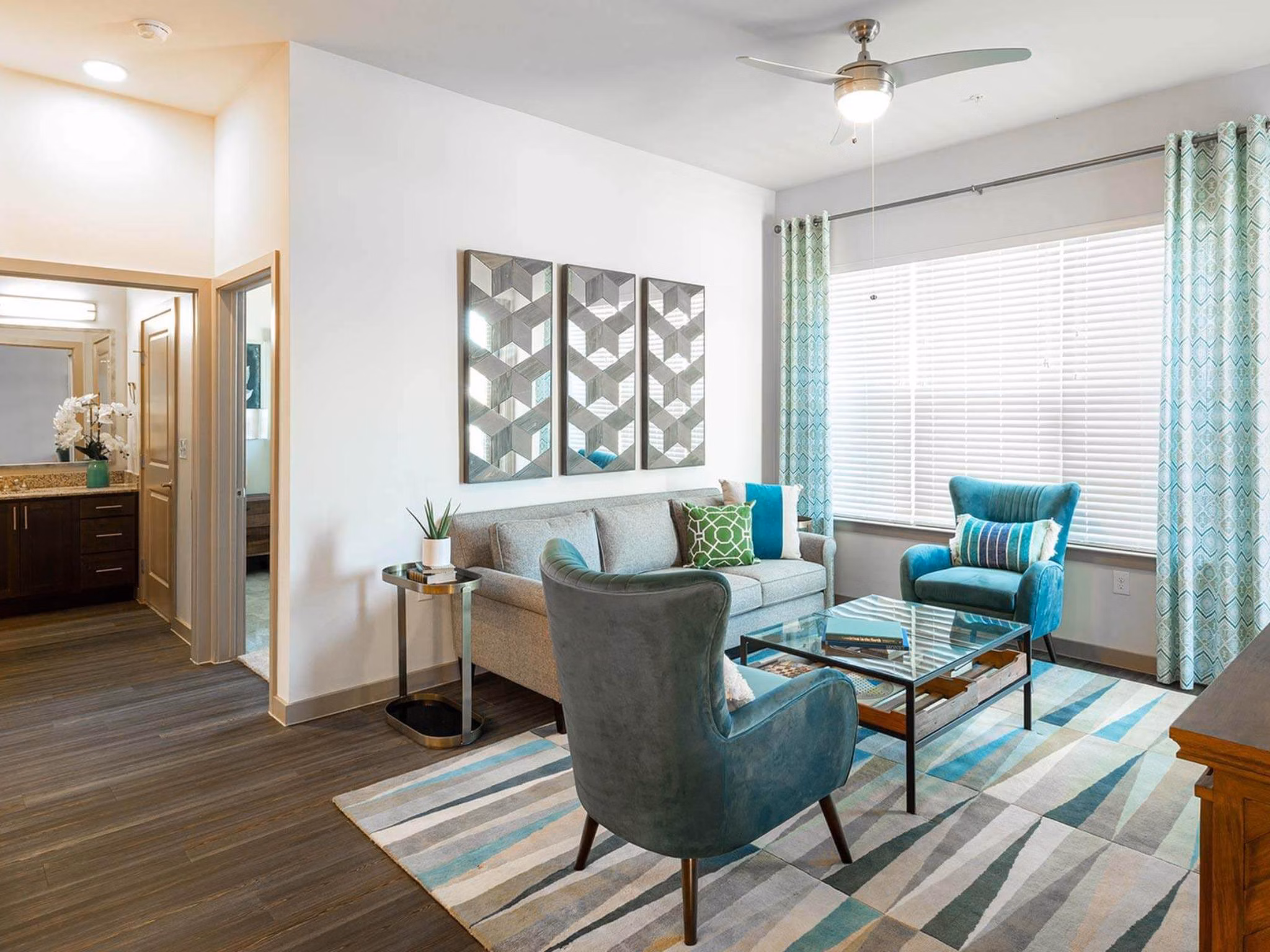 Spacious living room with modern decor in The Orchards at Market Plaza Apartments