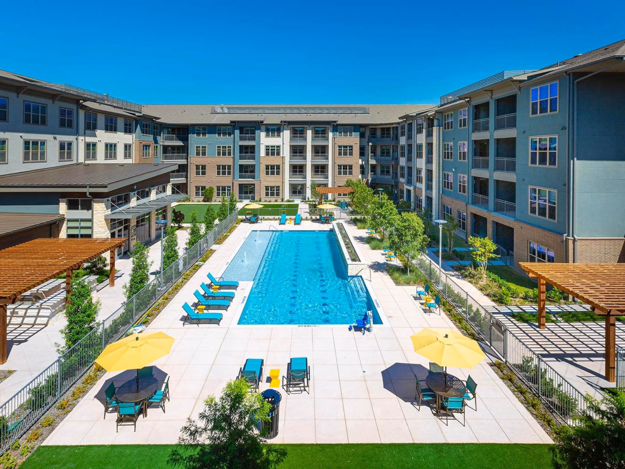 Spacious pool area at The Orchards at Market Plaza Apartments offering luxury living and relaxation