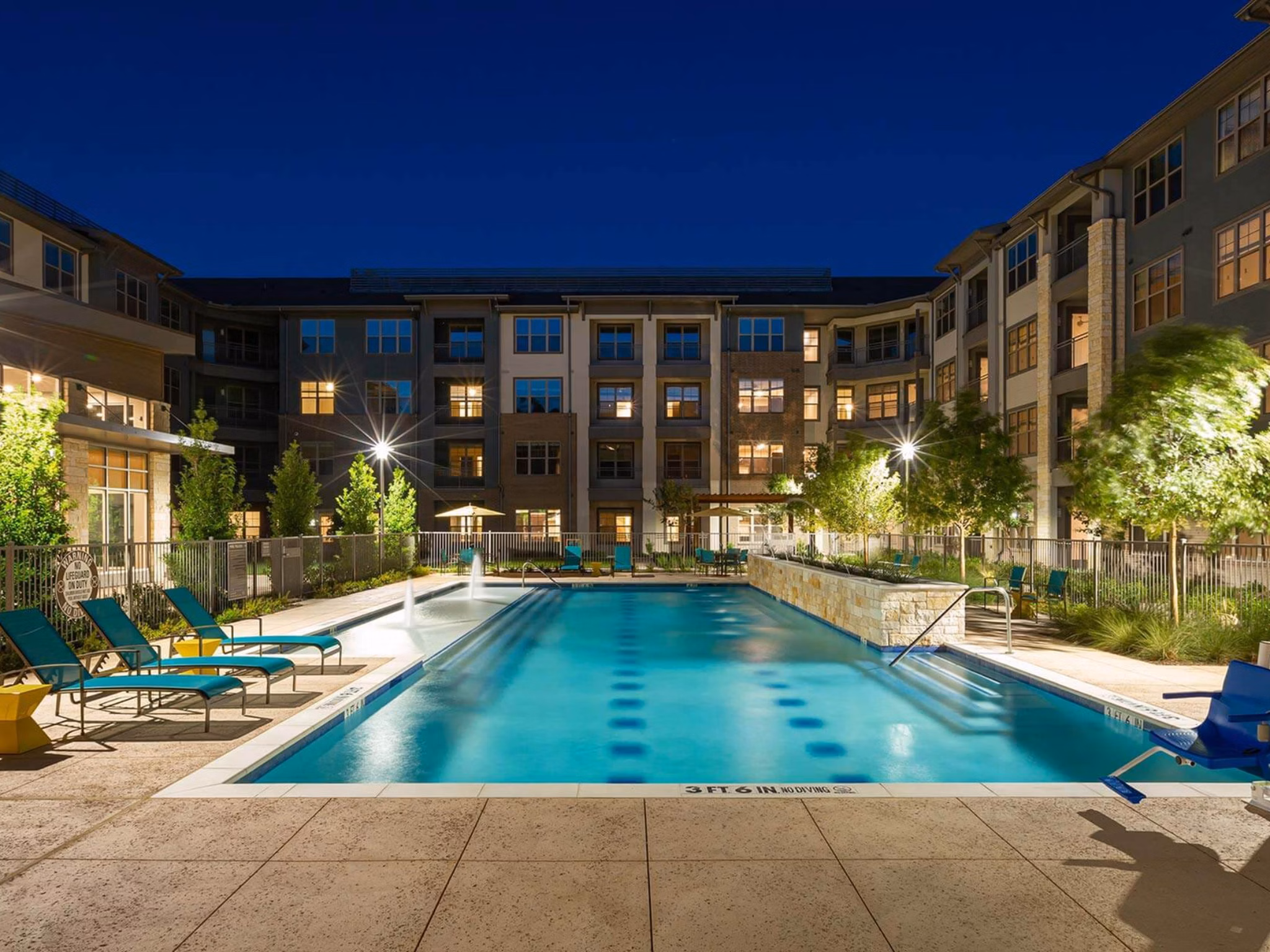 Modern outdoor pool at The Orchards at Market Plaza Apartments offering leisure and relaxation for residents