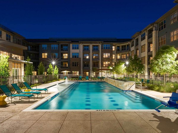 Modern outdoor pool at The Orchards at Market Plaza Apartments offering leisure and relaxation for residents