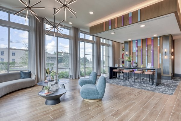 Encore Grayson Apartments: Elegant clubhouse featuring luxurious seating and modern decor