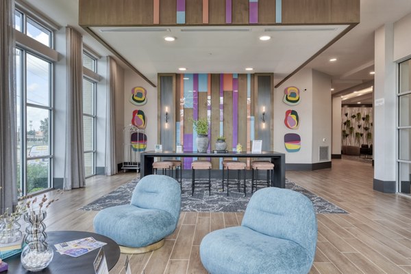 Clubhouse offering fitness center and social lounge at Encore Grayson Apartments