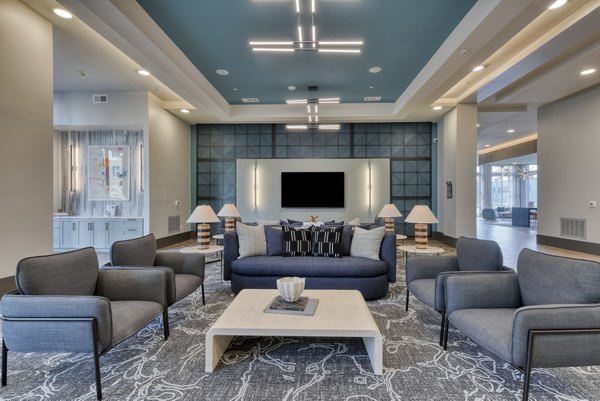 Clubhouse at Encore Grayson Apartments: Modern social space with seating and recreational amenities in a luxury apartment community