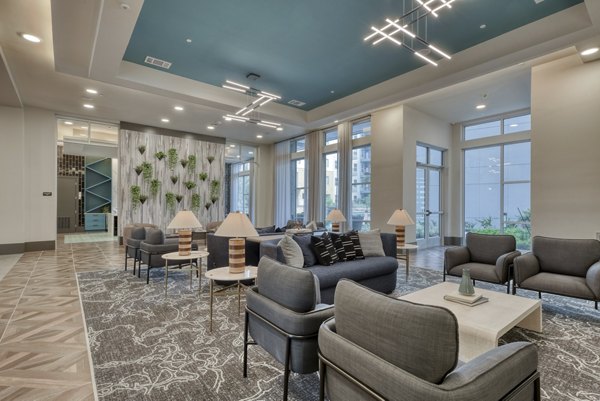 Clubhouse with modern decor and leisure spaces at Encore Grayson Apartments