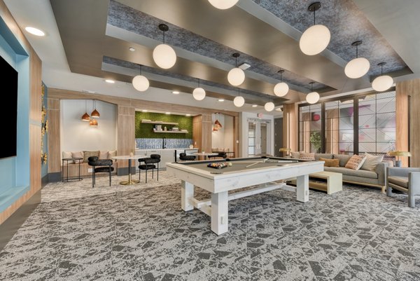 Clubhouse featuring modern decor and recreational spaces at Encore Grayson Apartments