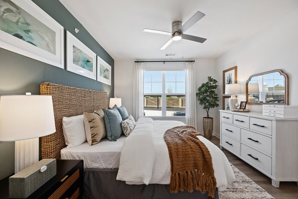 Cozy bedroom with modern decor at Silos Harvest Green Apartments