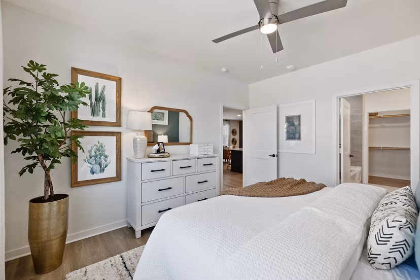 Cozy bedroom with stylish decor in Silos Harvest Green Apartments