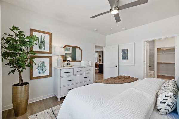 Cozy bedroom with stylish decor in Silos Harvest Green Apartments