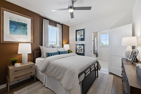 Modern bedroom with elegant decor at Silos Harvest Green Apartments