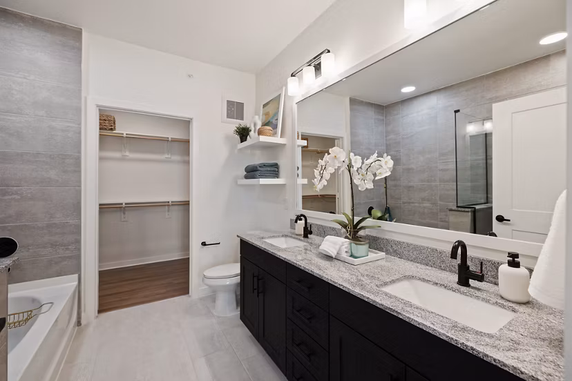 Bathroom featuring modern fixtures and sleek design in Silos Harvest Green Apartments