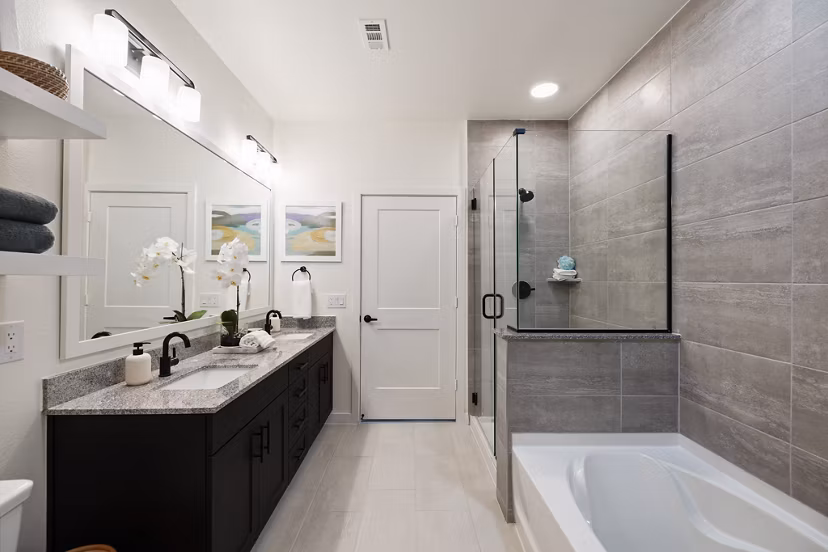 Bathroom featuring modern fixtures and ample lighting at Silos Harvest Green Apartments