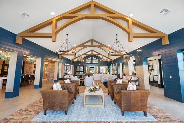 Clubhouse with modern seating and communal spaces at Silos Harvest Green Apartments in Richmond, featuring stylish interiors for social gatherings