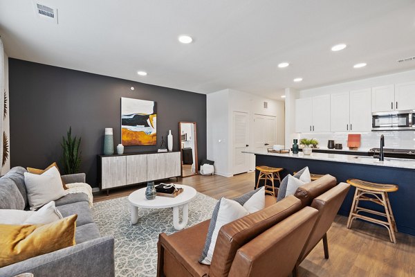 Modern kitchen with stainless steel appliances at Silos Harvest Green Apartments