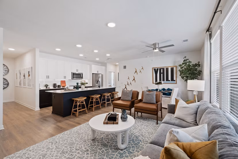 Spacious living room with modern decor at Silos Harvest Green Apartments