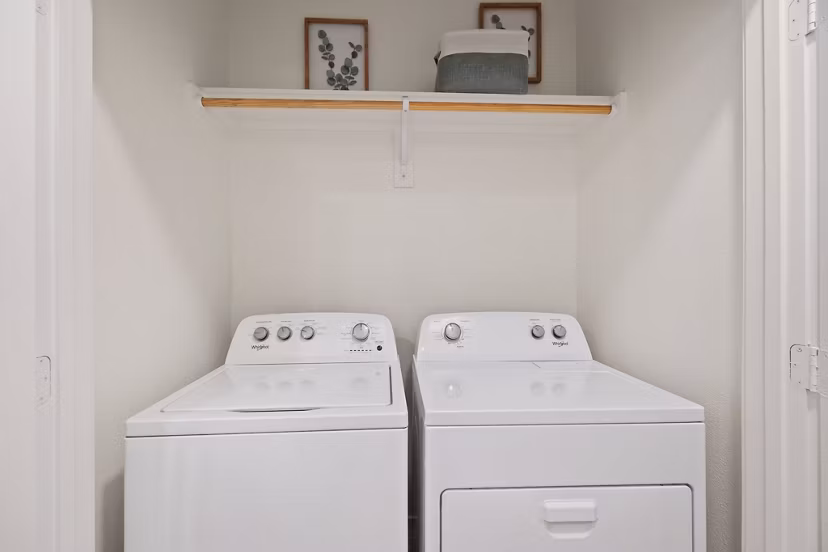 Laundry room featuring modern washers and dryers at Silos Harvest Green Apartments