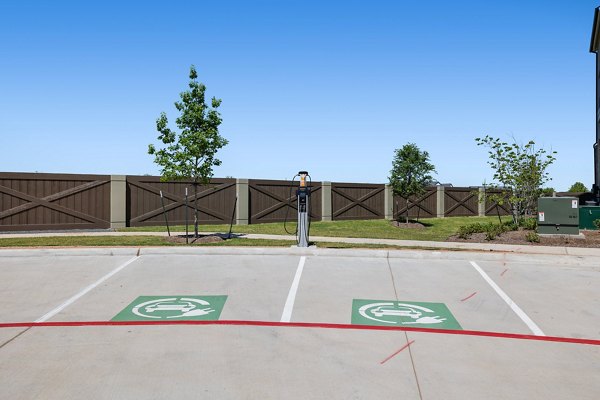 Car charging station at Silos Harvest Green Apartments offering sustainable living options for eco-conscious residents