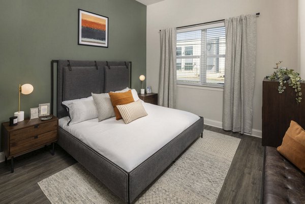 Bedroom featuring modern furniture and neutral tones in Prose McCullough Station Apartments