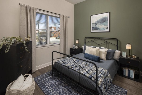 Modern bedroom featuring stylish decor at Prose McCullough Station Apartments