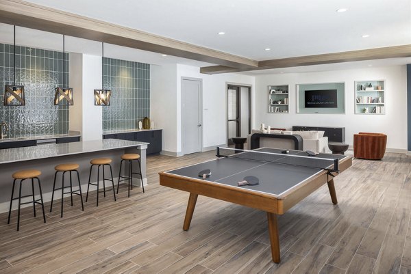 Clubhouse lounge with modern furnishings at Prose McCullough Station Apartments featuring luxury amenities