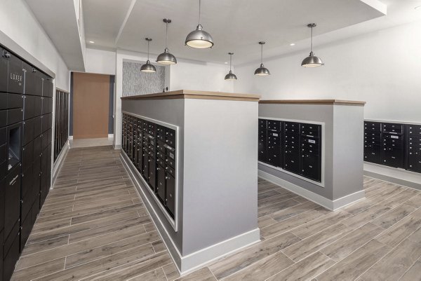 Modern mail room with secure package lockers at Prose McCullough Station Apartments