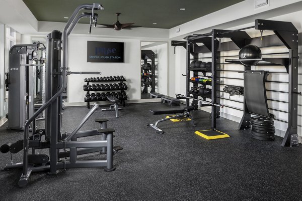 State-of-the-art fitness center equipped with modern exercise machines at Prose McCullough Station Apartments