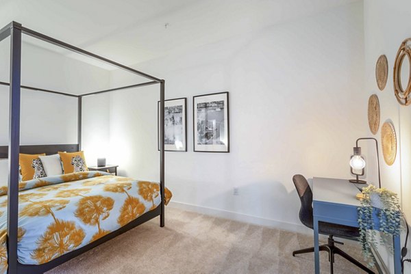 Comfortable bedroom with natural light at The Lydell Apartments
