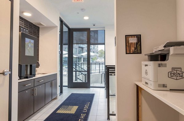 Modern business center with sleek workstations at The Lydell Apartments, offering residents a dedicated space for productivity and work