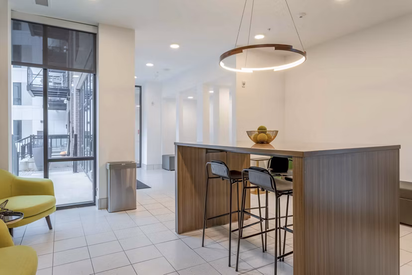 Luxury clubhouse with modern decor at The Lydell Apartments, offering a stylish gathering space for residents