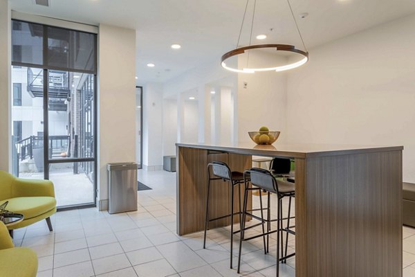 Luxury clubhouse with modern decor at The Lydell Apartments, offering a stylish gathering space for residents