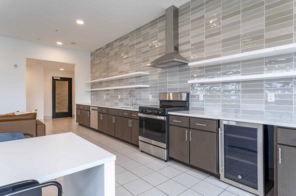 Luxurious clubhouse with modern decor at The Lydell Apartments, perfect for social gatherings and relaxation