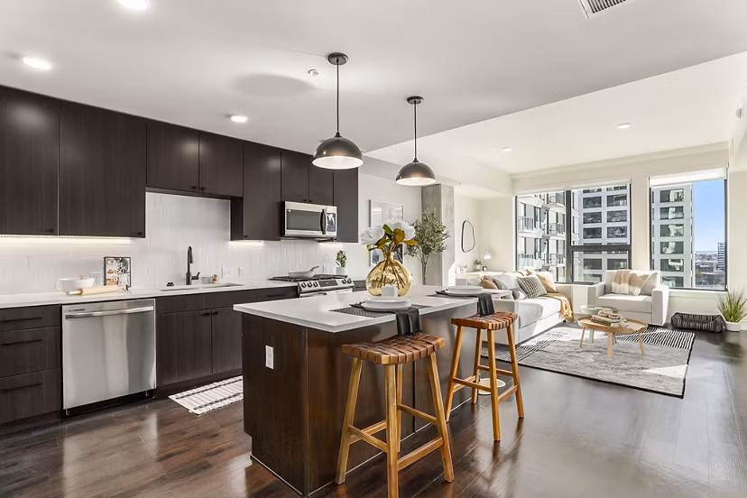 Modern kitchen with stainless steel appliances at One Seven Belleview Station Apartments