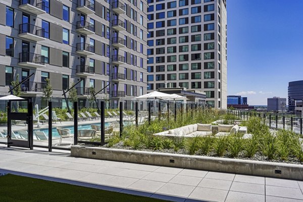 Patio with modern seating and planters at One Seven at Belleview Station Apartments, offering luxury outdoor living spaces