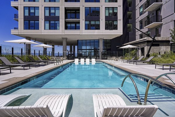 Amenity description for luxury apartments in Denver:

Modern pool area at One Seven at Belleview Station Apartments, offering relaxation and recreational spaces for residents