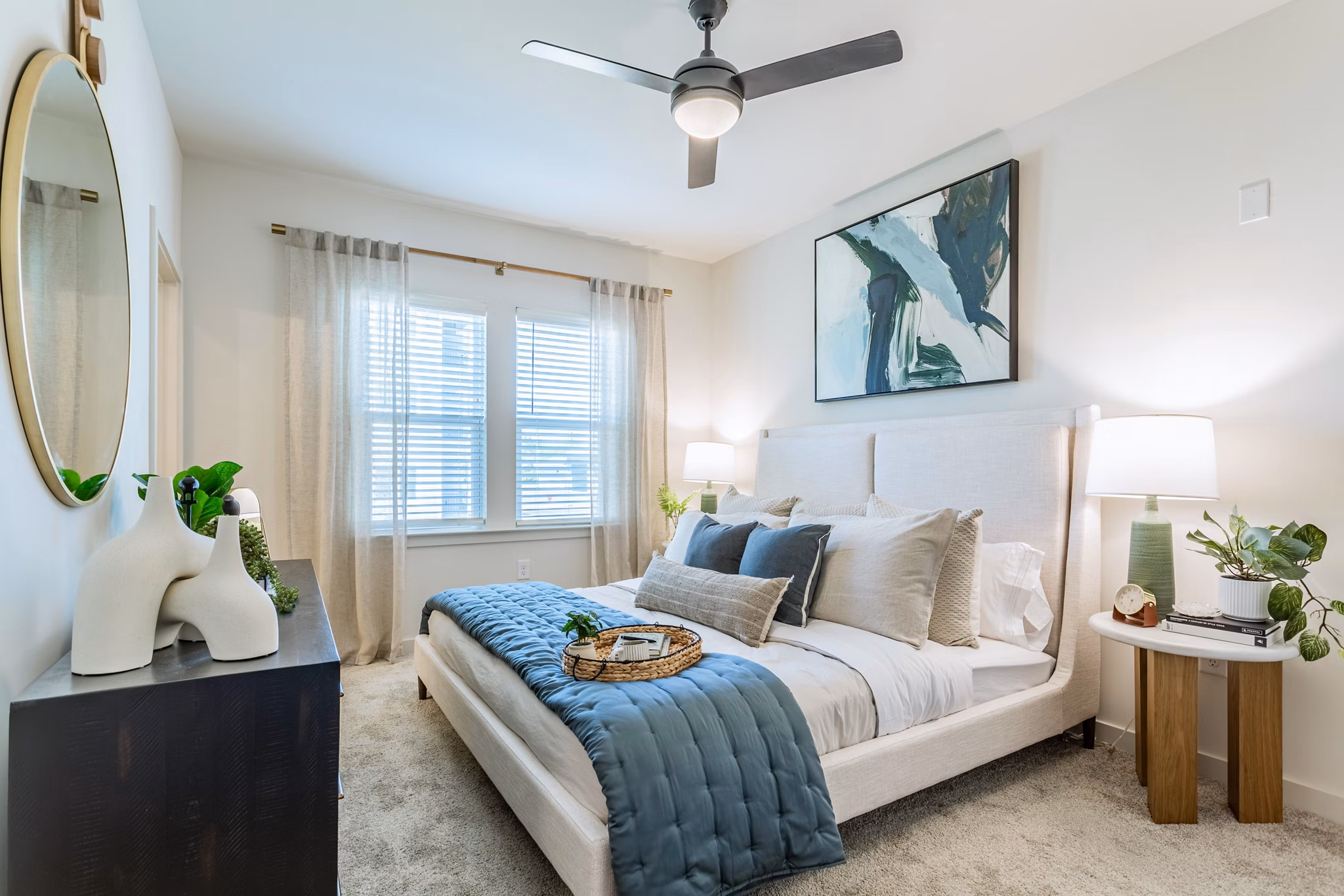 Cozy bedroom with modern furnishings at Birchway Rivergate Apartments
