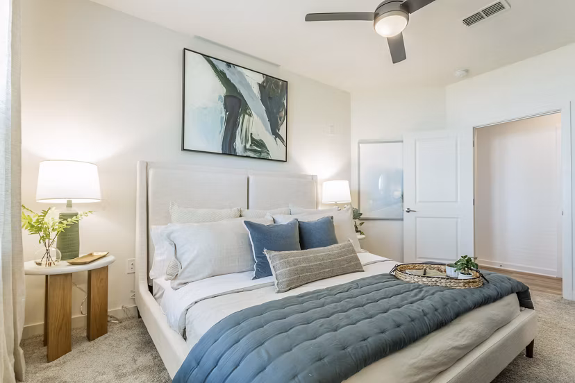 Cozy bedroom with modern decor at Birchway Rivergate Apartments
