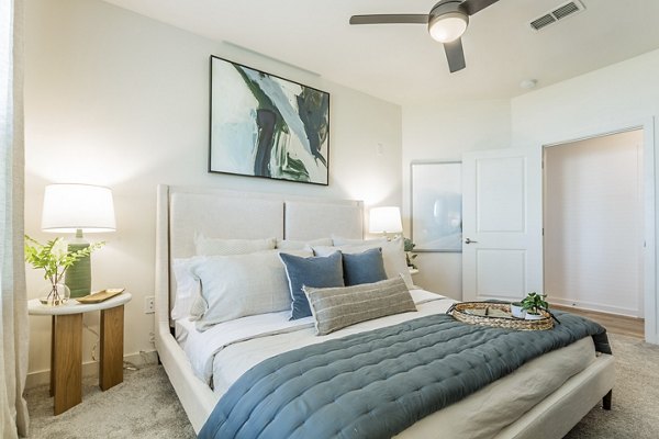 Cozy bedroom with modern decor at Birchway Rivergate Apartments