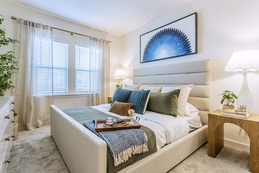 Cozy bedroom with modern decor in Birchway Rivergate Apartments, offering luxury living spaces tailored for comfort